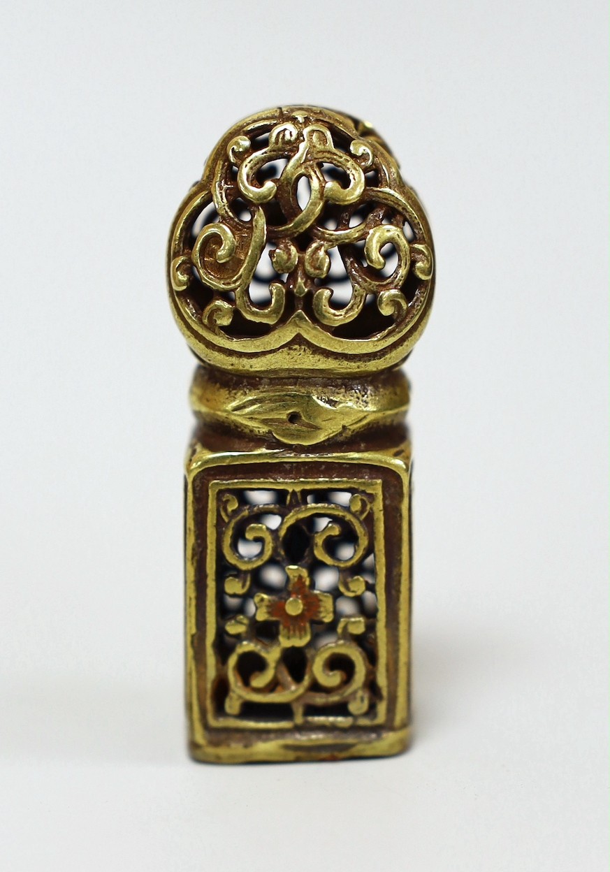 A Tibetan pierced bronze seal, 5.5cm